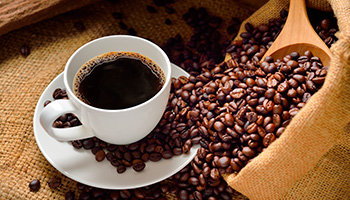 Xícara e grãos de café Pagliuso